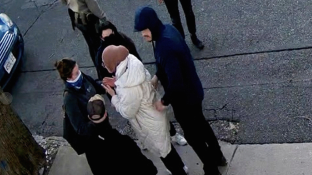 Turkish national Rumeysa Ozturk being detained by ICE agents.